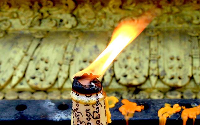 Burning candle in a temple.