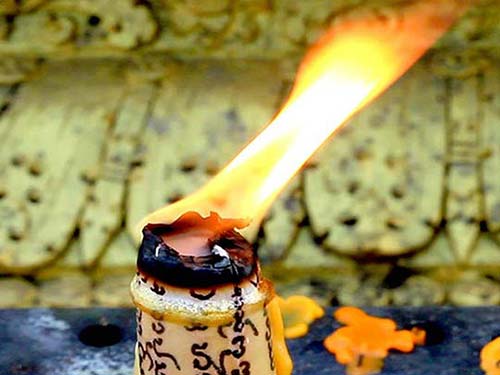 Burning candle in a temple.