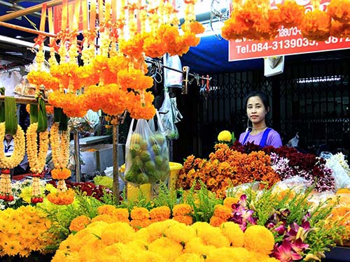 Stall of flowers in a market, for offerings.